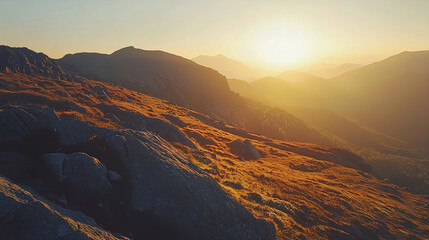 AI Generated - Stunning view of the sun setting over a mountain range, with the sun casting a golden hue over the hills and grassy terrain. Commercial illustration artwork for business applications.