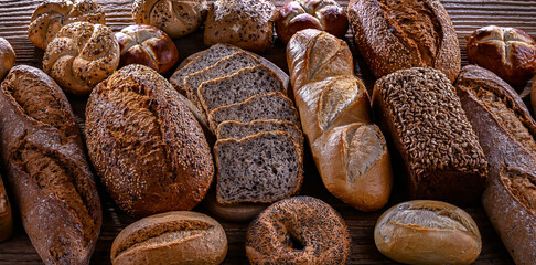 Assorted bakery products including loaves of bread and rolls