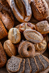Assorted bakery products including loaves of bread and rolls