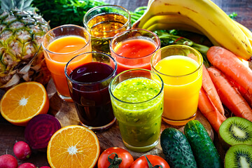 Glasses with fresh organic vegetable and fruit juices