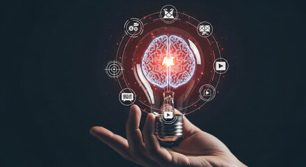 Illuminated brain inside a light bulb with technology icons