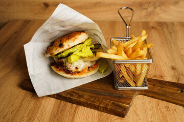 Beef burger with grilled onions and fries