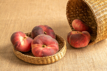 Sweet fig peaches on jute cloth, macro.
