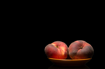 Sweet fig peaches isolated on black background, macro.