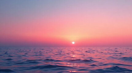 Obraz premium Serene ocean sunset with pink and blue gradient sky creating a peaceful ambiance