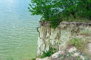 Mount Pyvykha rises along the shore of the Kremenchuk Reservoir in Ukraine, resembling a massive...