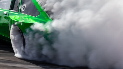 Car drifting, Blurred image diffusion race drift car with lots of smoke from burning tires on speed track, Car drifting on speed track, Professional driver drive drifting car. © Kalyakan