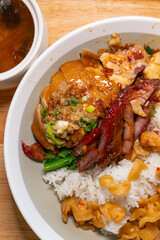 angle view soy sauce chicken and bbq pork rice with black chicken and cordyceps flower soup at vertical composition