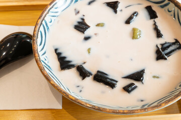 angle view bowl of Licorice black jelly with honey horizontal composition
