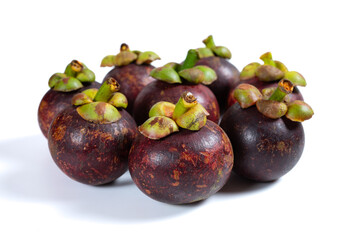 fresh mangosteens on a white background