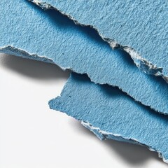Close Up Of Blue Torn Paper Layers On White Background
