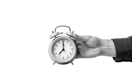Old classic metal alarm clock with a hand holding a watch over a white background