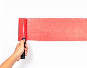 A minimalist composition captures a hand painting a red horizontal stripe on a white wall using a roller with black handle.