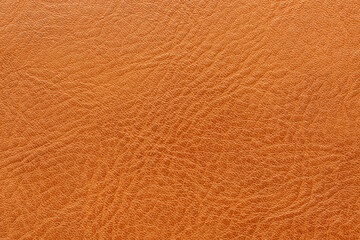 Macro brown synthetic leather texture,Close-up texture of brown synthetic leather with fine grain pattern.