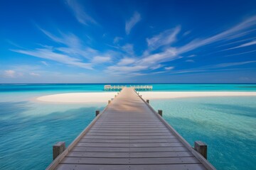 Fototapeta premium A serene wooden pier extends into the tranquil sea, inviting strolls on a tropical beach
