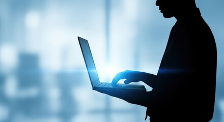 Silhouette of a man working with a laptop. Freelancer typing on computer keyboard. Digital solution or internet technology concept.