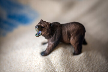 The concept of psychology. Sand
therapy. A bear figurine in a blue sandbox.
Psychology. Therapy. POST-TRAUMATIC
stress disorder. Confrontation. Aggression. PTSD. 