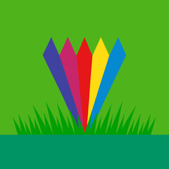 Colorful fan shapes emerging from green grass