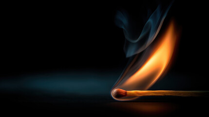 A single matchstick with a soft flame, dark background