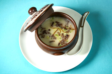 Aromatic Ten Year Old Tangerine Peel and Fish Paste Soup in savory broth with chopped scallions top view of Asian soup