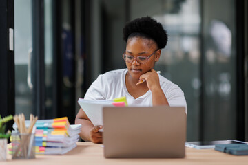 Business Documents, African American woman checking searching document for analysis TAX...