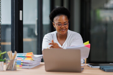 Business Documents, African American woman checking searching document for analysis TAX...