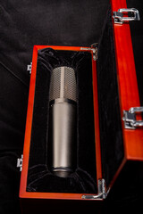 Studio microphone silver professional in a wooden box