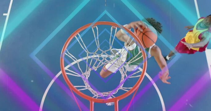 Green basketball player dribbling across neon court dunking past red-yellow defender scoring points