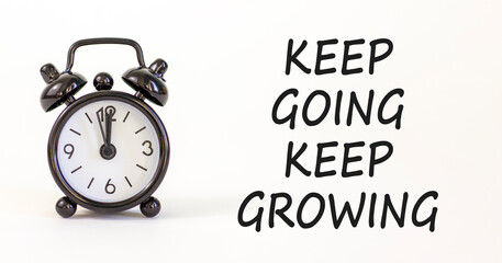 Keep going and growing symbol. Concept words phrase Keep going keep growing on beautiful white...