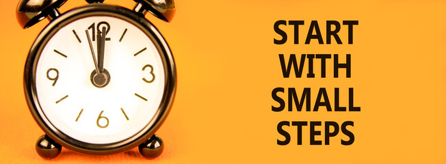 Start with small steps symbol. Concept words Start with small steps on beautiful orange paper....