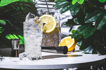 non-alcoholic cocktail drink or mocktail with syrup, juice, tonic water and a lemon wheel