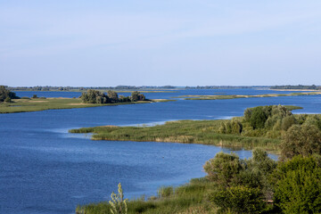 Russian landscape with Volga river on a sunny day. Bolgar, Tatarstan, Russia. View on the valley of Volga river from the hill. Peaceful nature. Beautiful background.