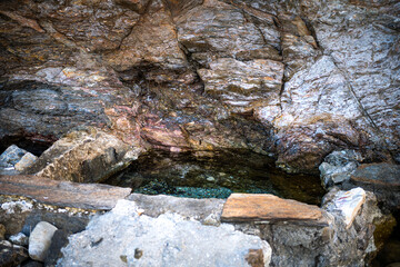 Agia Kyriaki thermal hot springs at Almyrida, Ikaria island, Greece fishing village with radioactive radon water, longevity blue zone