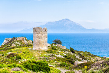 Drakano tower high angle aerial view of landscape picturesque Samos island in background on Ikarian Sea Aegean islands at Ikaria island, Greece
