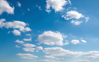 A clear blue sky with fluffy white clouds