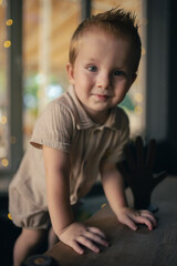 Little boy leaning on table in cafe