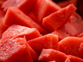 Close-up of juicy watermelon slices with vibrant red color and textured surface.
