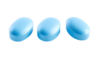 Three light blue pharmaceutical pills on transparent background