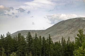A wide view of the old mine in Thetford Mines, Quebec, showing the exposed earth and excavation layers from past mining activity.