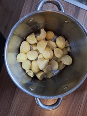 A pan with peeled potatoes ready to be cooked