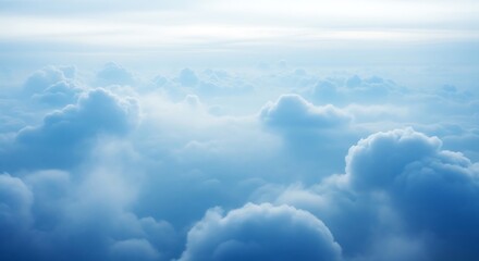 Aerial view of soft and fluffy clouds in a peaceful blue sky