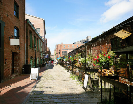 Restaurants along historic Wharf St in downtown Portland Maine.