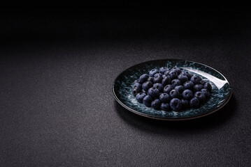 Fresh juicy blueberries, healthy vegan food with vitamins and minerals. Blueberries berry