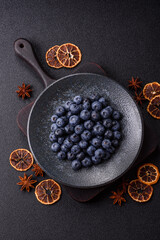 Fresh juicy blueberries, healthy vegan food with vitamins and minerals. Blueberries berry