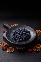 Fresh juicy blueberries, healthy vegan food with vitamins and minerals. Blueberries berry