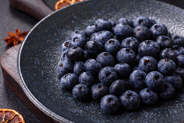 Fresh juicy blueberries, healthy vegan food with vitamins and minerals. Blueberries berry