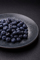 Fresh juicy blueberries, healthy vegan food with vitamins and minerals. Blueberries berry