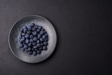 Fresh juicy blueberries, healthy vegan food with vitamins and minerals. Blueberries berry