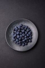 Fresh juicy blueberries, healthy vegan food with vitamins and minerals. Blueberries berry