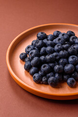 Fresh juicy blueberries, healthy vegan food with vitamins and minerals. Blueberries berry